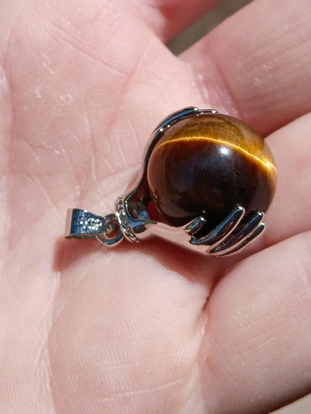 New 18K Hands Holding Tiger Eye Sphere Pendant.